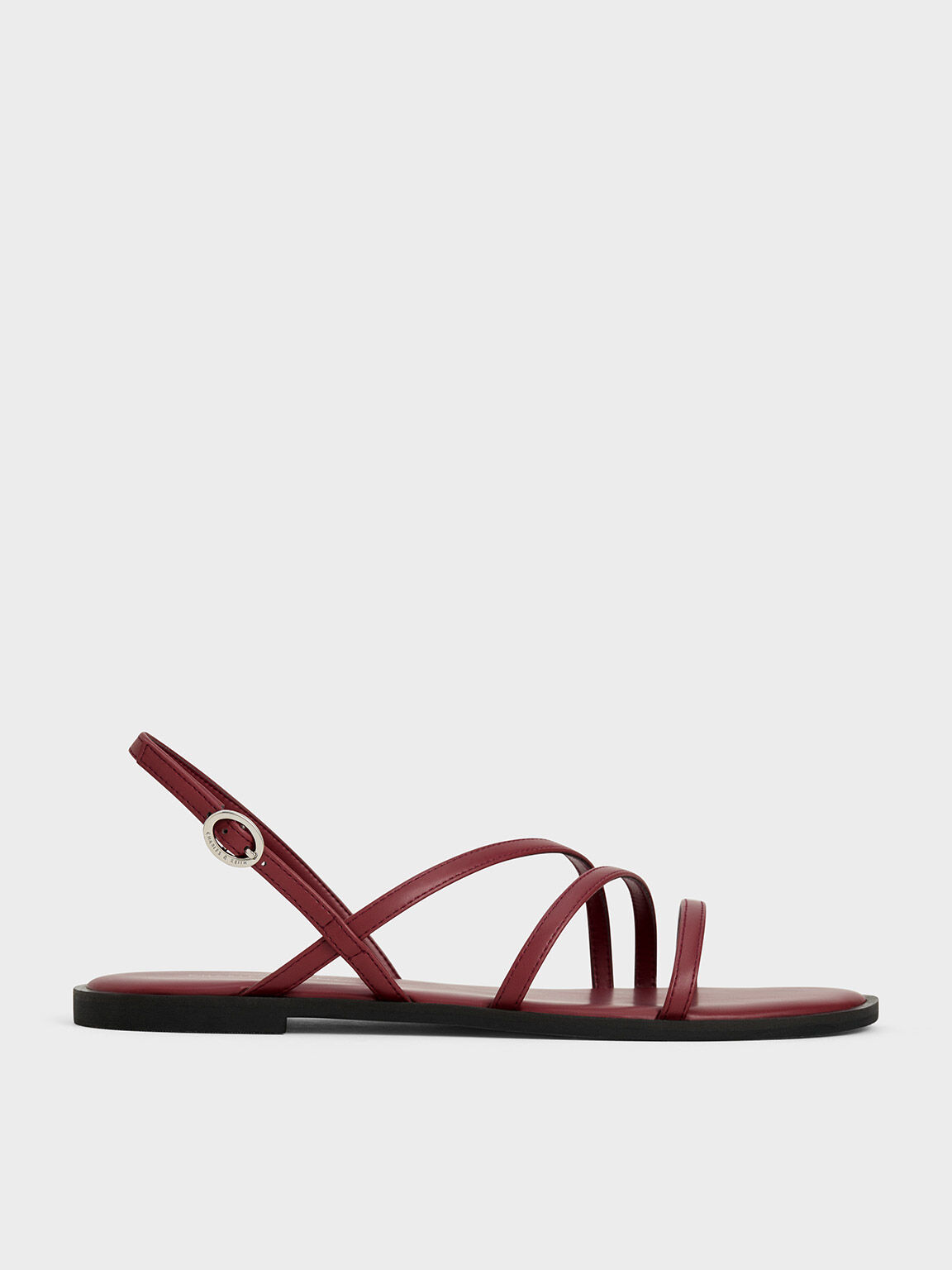 Rockstud Flat Calfskin Sandal With Straps for Woman in Black | Valentino US