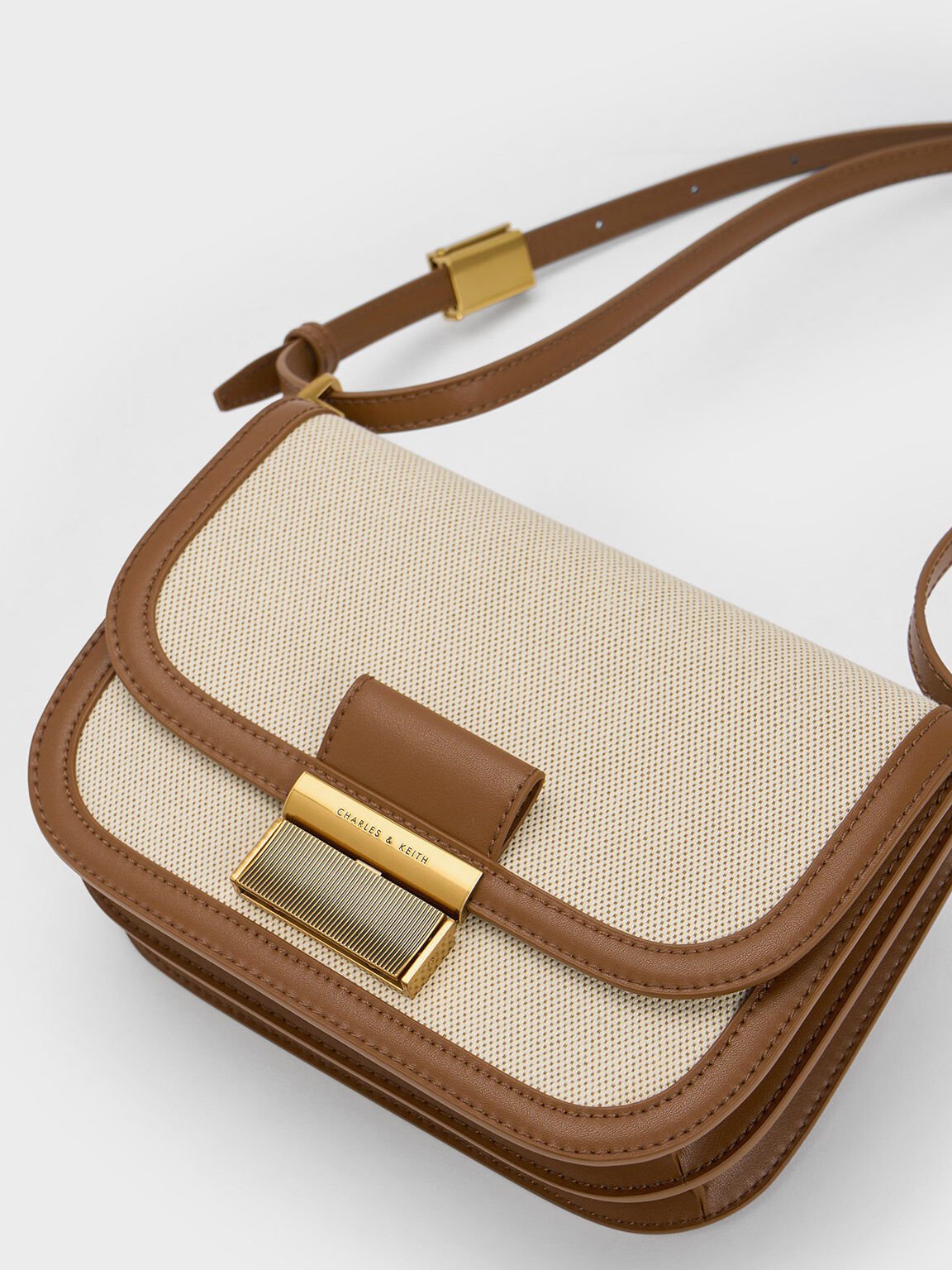 Women’s Charlot canvas crossbody bag in chocolate - CHARLES & KEITH